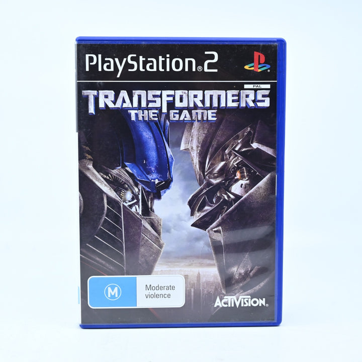 Transformers The Game- Sony Playstation 2 / PS2 Game + Manual - NEAR MINT DISC!