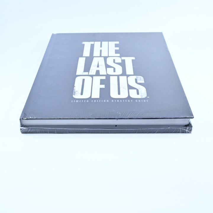 SEALED! The Last of Us Limited Edition Strategy Guide + Keychain - Brady Games