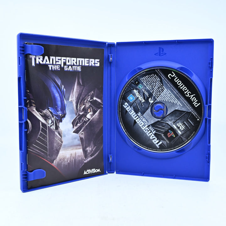 Transformers The Game- Sony Playstation 2 / PS2 Game + Manual - NEAR MINT DISC!